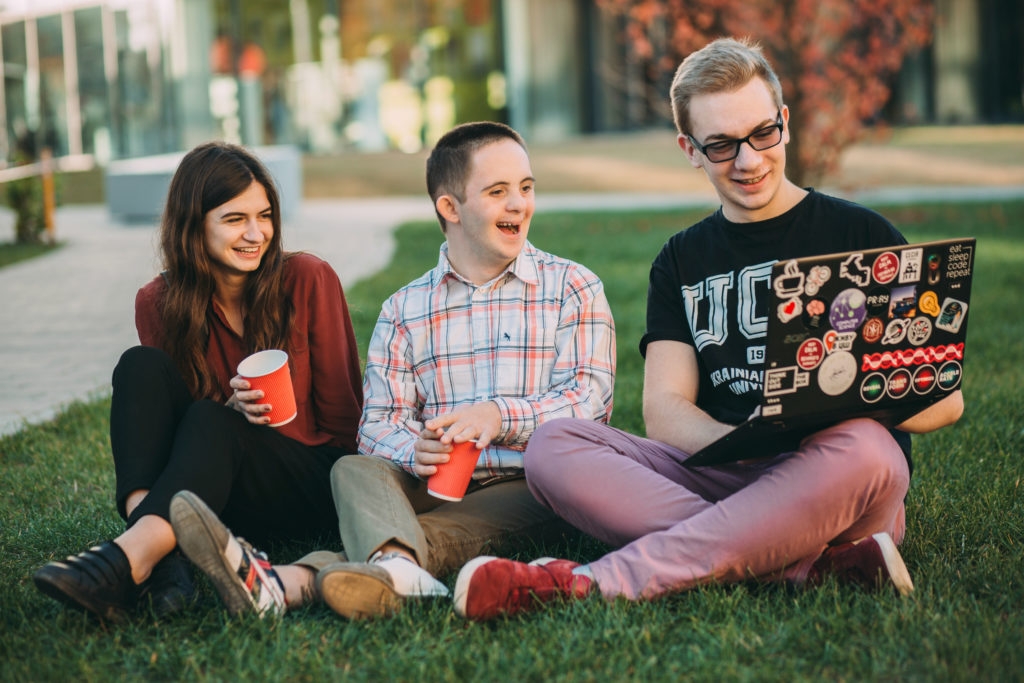 4.27 Students Sitting On A Grass Field Courtesy Ukraine Catholic University